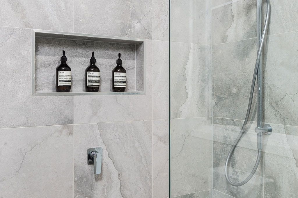 Brisbane Bathroom Company Bathroom Shower Wall Renovation with glass shower screen located in Bardon